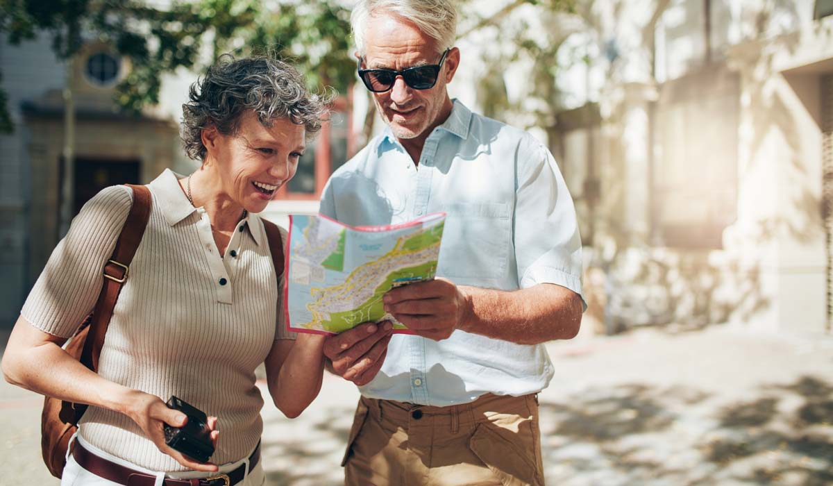 bigstock-Senior-Couple-Reading-A-Touris-138316946